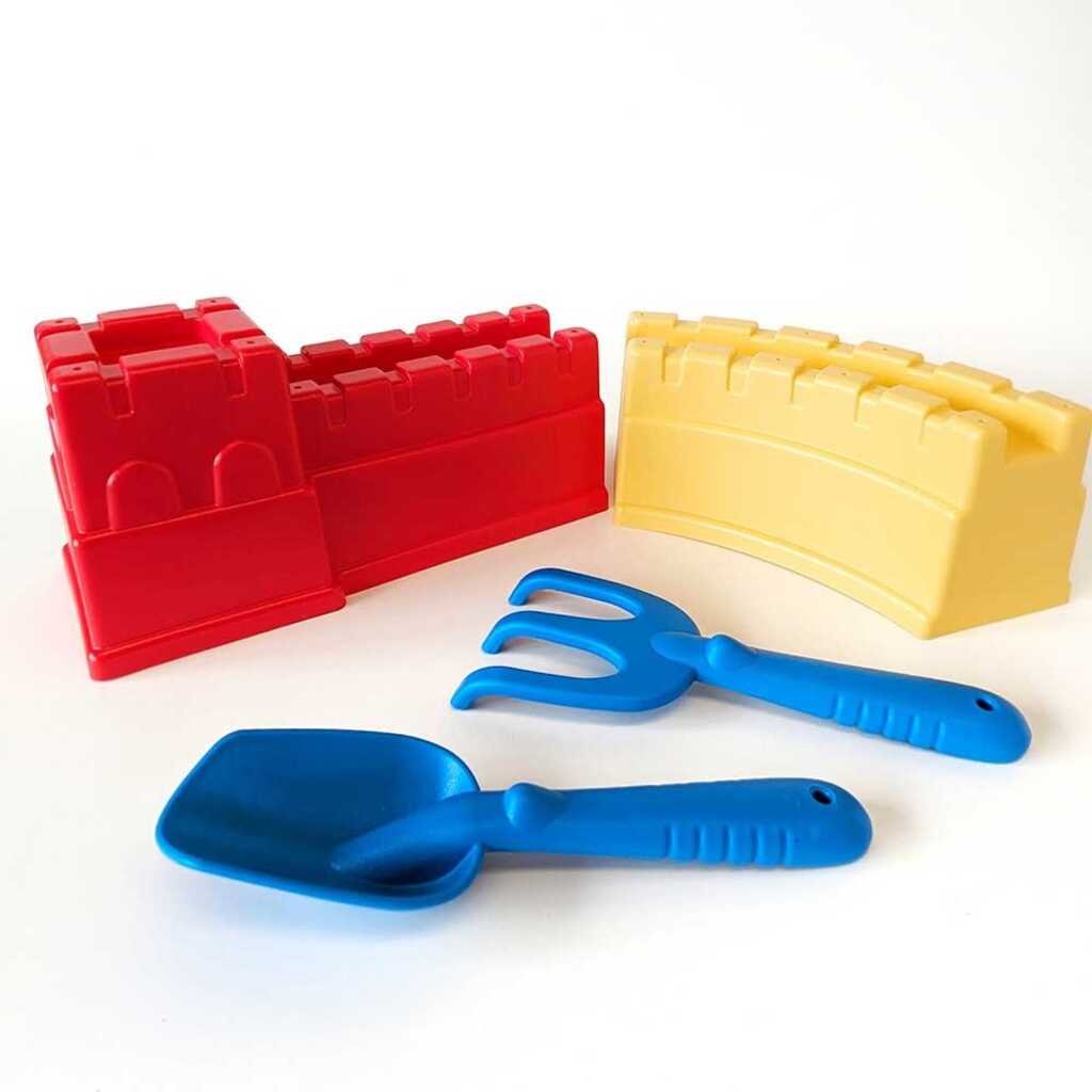 set de platja amb pala, rasclet i castel