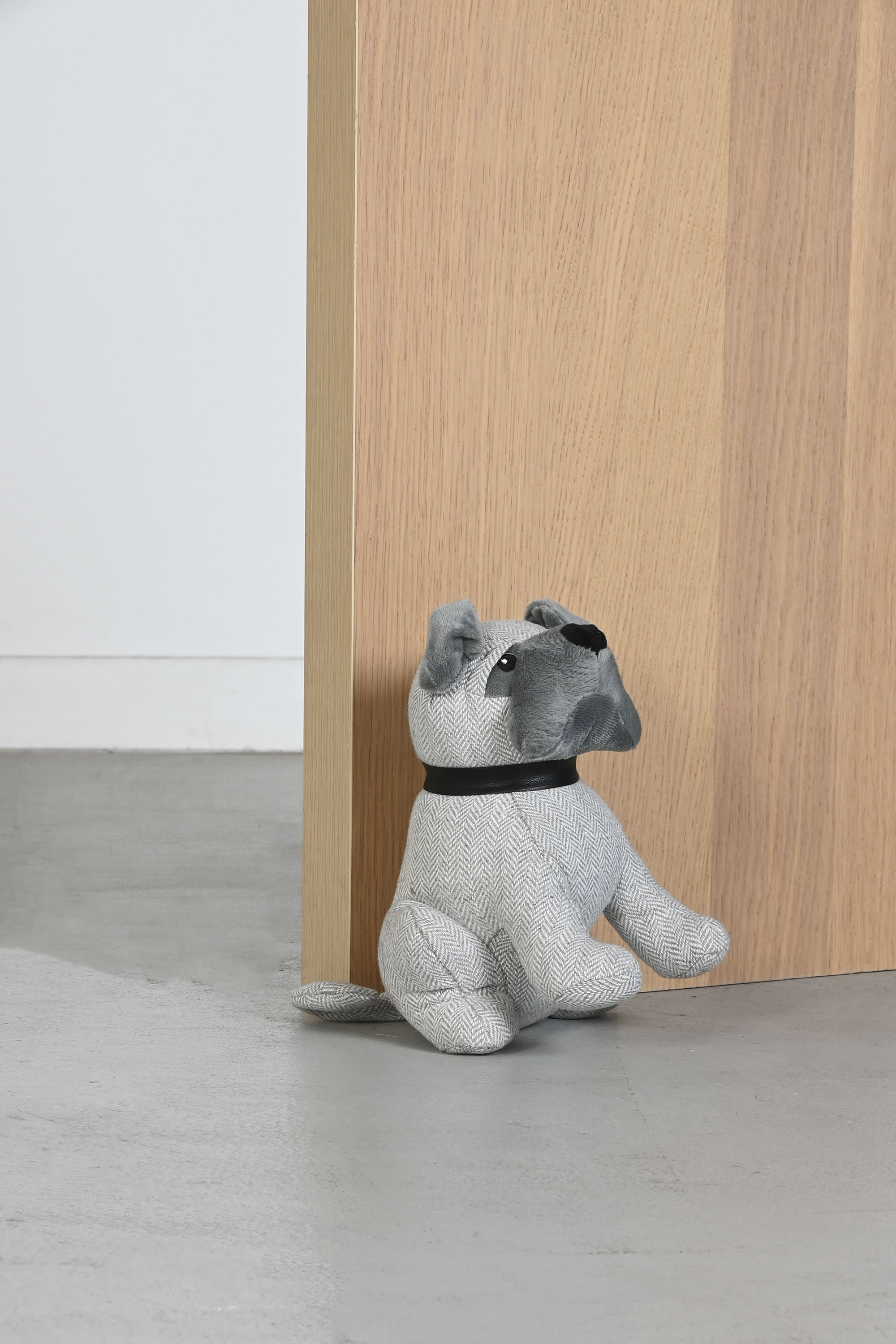 SUJETAPUERTAS POLIESTER 16X22X22 0,50 PERRO GRIS 2