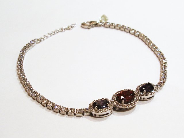 Pulsera de Circonitas blancas, moradas y roja en Plata rodiada