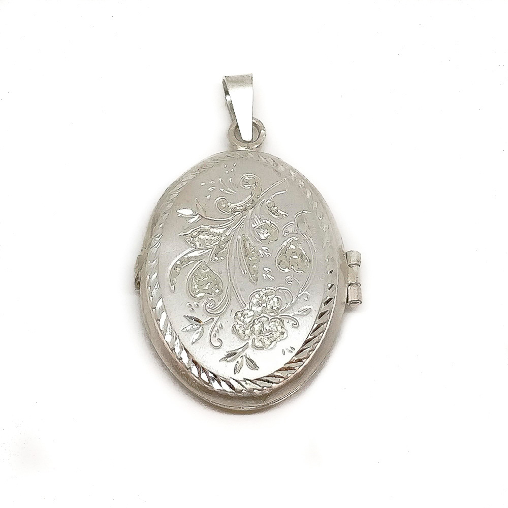 Guardapelos ovalado de Plata de ley tallada 23 x 31 Mm.