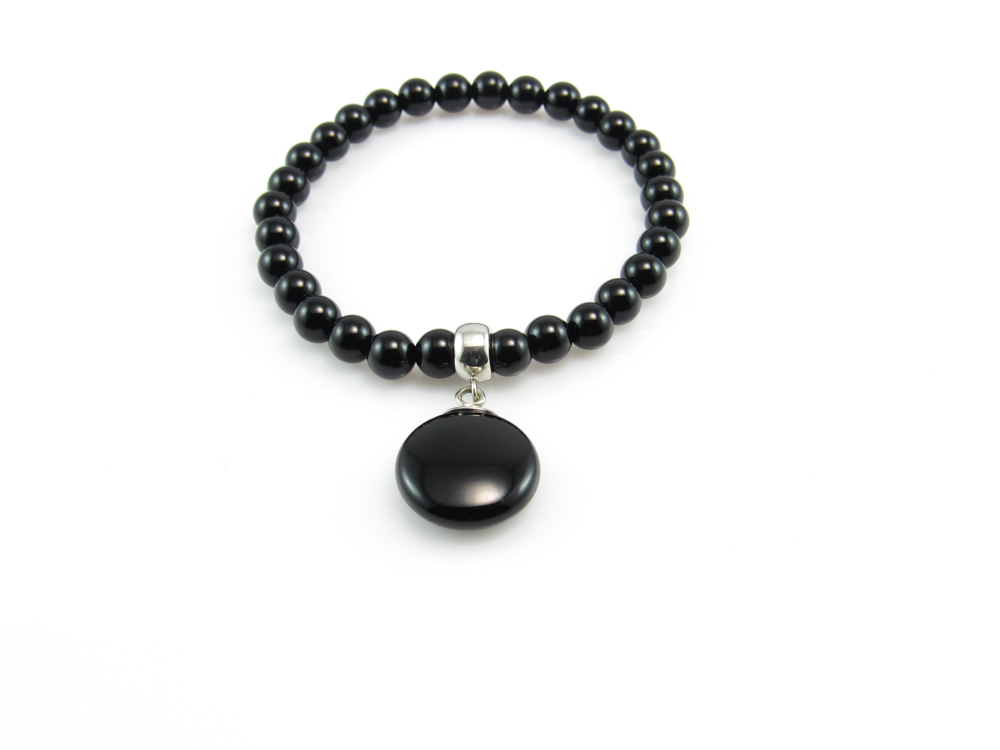 Pulsera elastica Plata de ley y bolas de onix 6 Mm.