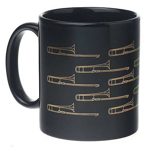REGALO- TAZA NEGRA CON TROMBONES DORADOS