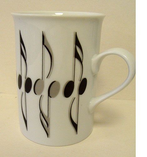 REGALO-TAZA ALARGADA BLANCA CON NOTAS MUSICALES NEGRAS Y GRISES *DESCATALOGADO*